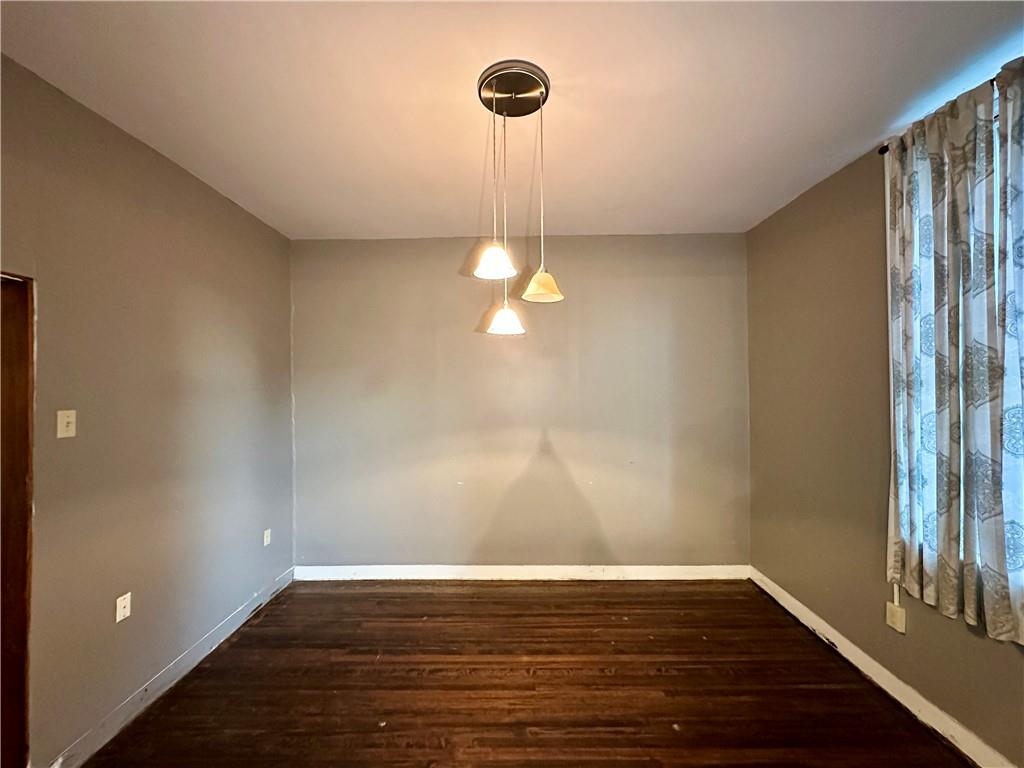 118 Firehall Road Portersville, PA 16051 - Photo 12 of 29 a view of empty room with wooden floor and fan