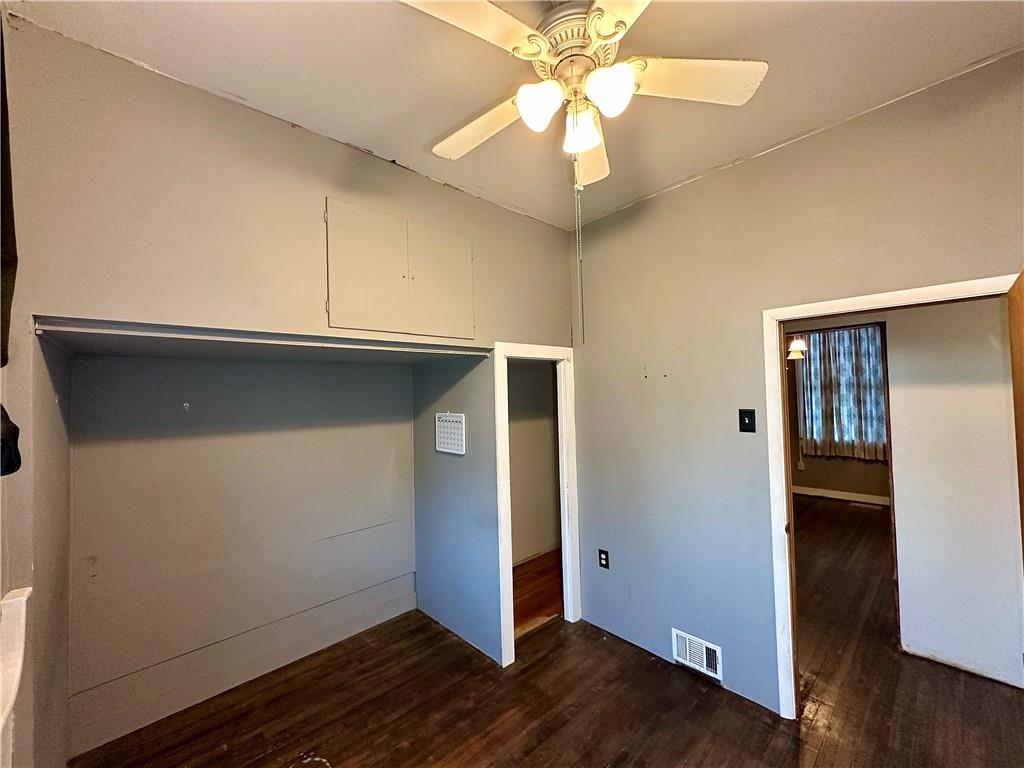 118 Firehall Road Portersville, PA 16051 - Photo 16 of 29 an empty room with wooden floor closet and windows
