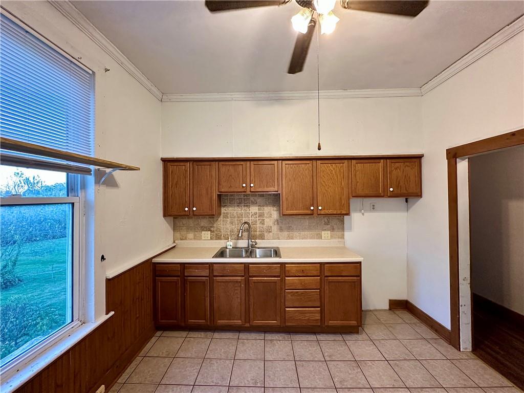 118 Firehall Road Portersville, PA 16051 - Photo 17 of 29 a kitchen with a sink a refrigerator and cabinets