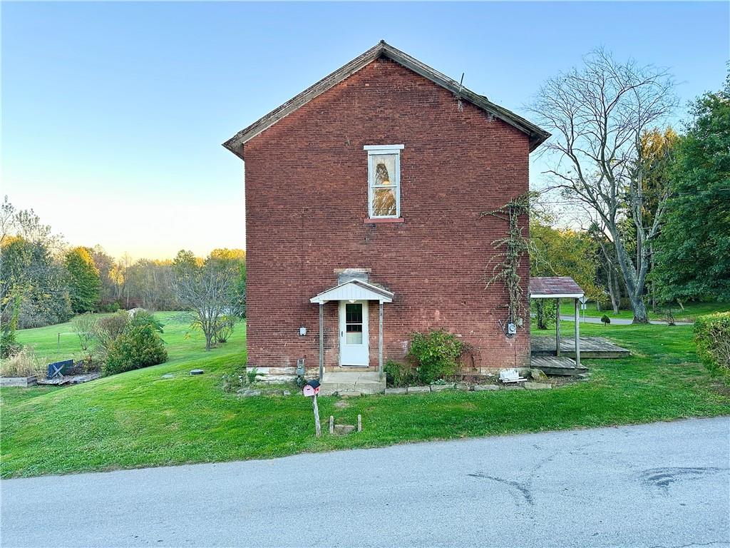 118 Firehall Road Portersville, PA 16051 - Photo 2 of 29 a front view of a house with garden