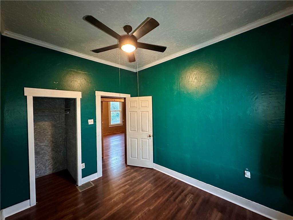 118 Firehall Road Portersville, PA 16051 - Photo 23 of 29 wooden floor in an empty room with a window