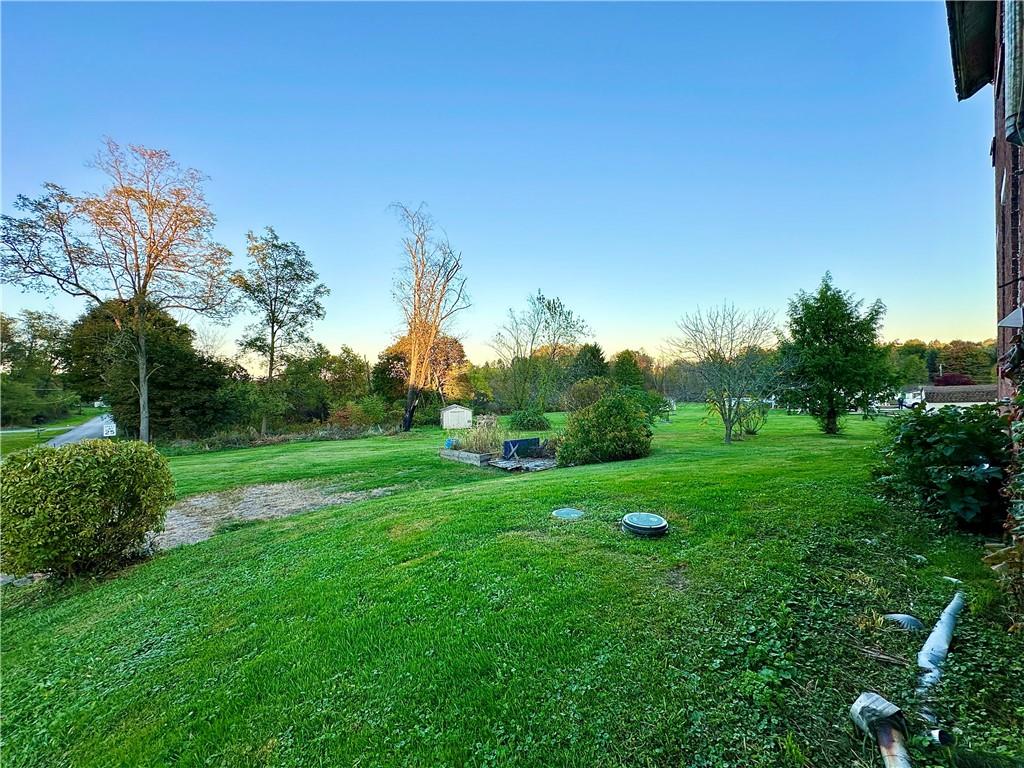 118 Firehall Road Portersville, PA 16051 - Photo 5 of 29 a view of a grassy field with trees