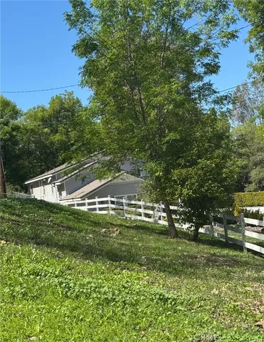 a view of a park with large trees
