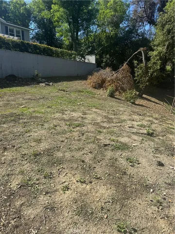 a backyard of a house with lots of green space