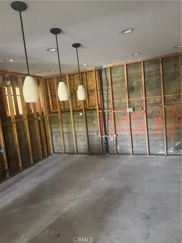 a view of an empty room with windows