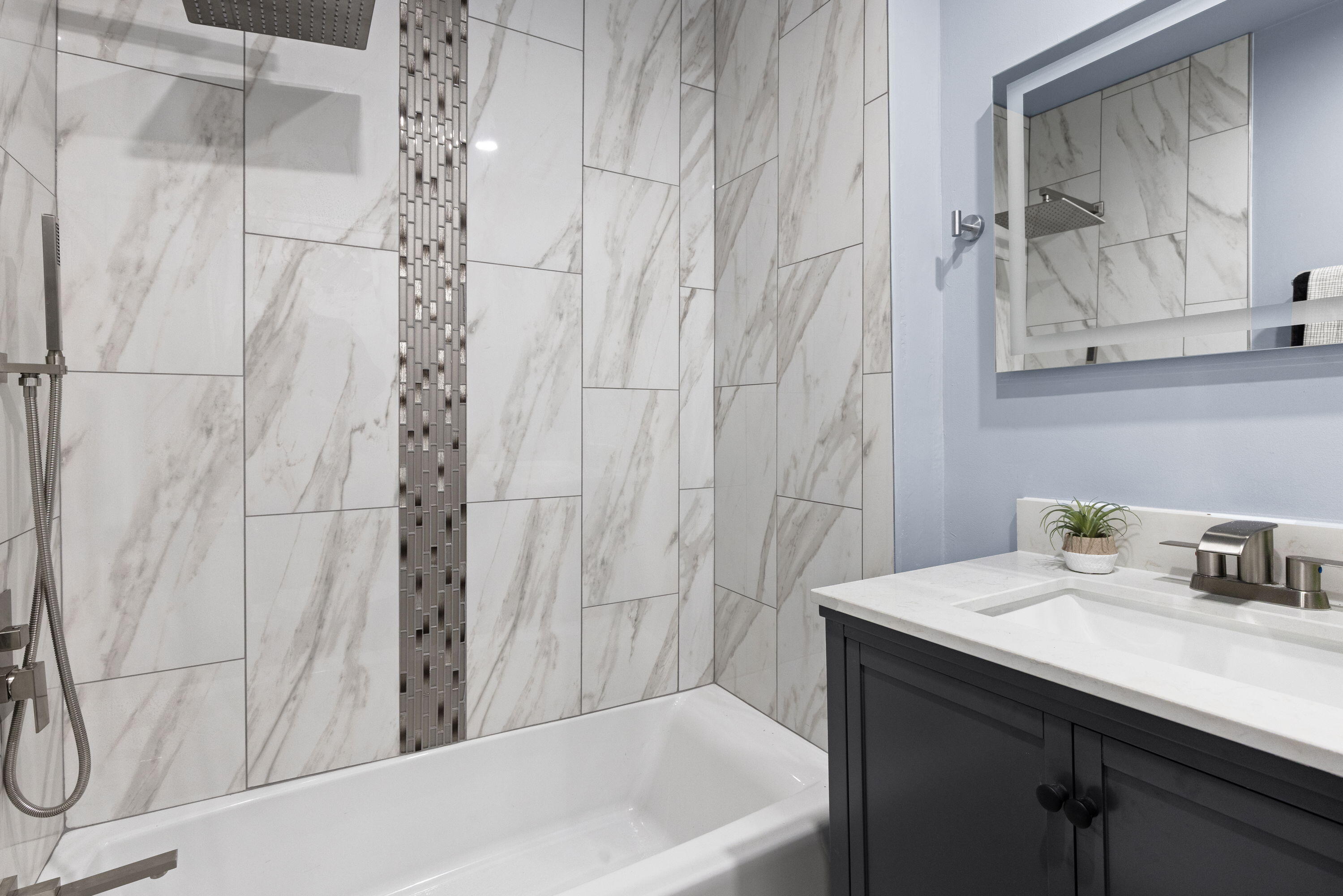 6344 West 25th Avenue Gary, IN 46406 - Photo 16 of 52 a bathroom with a sink and a bathtub