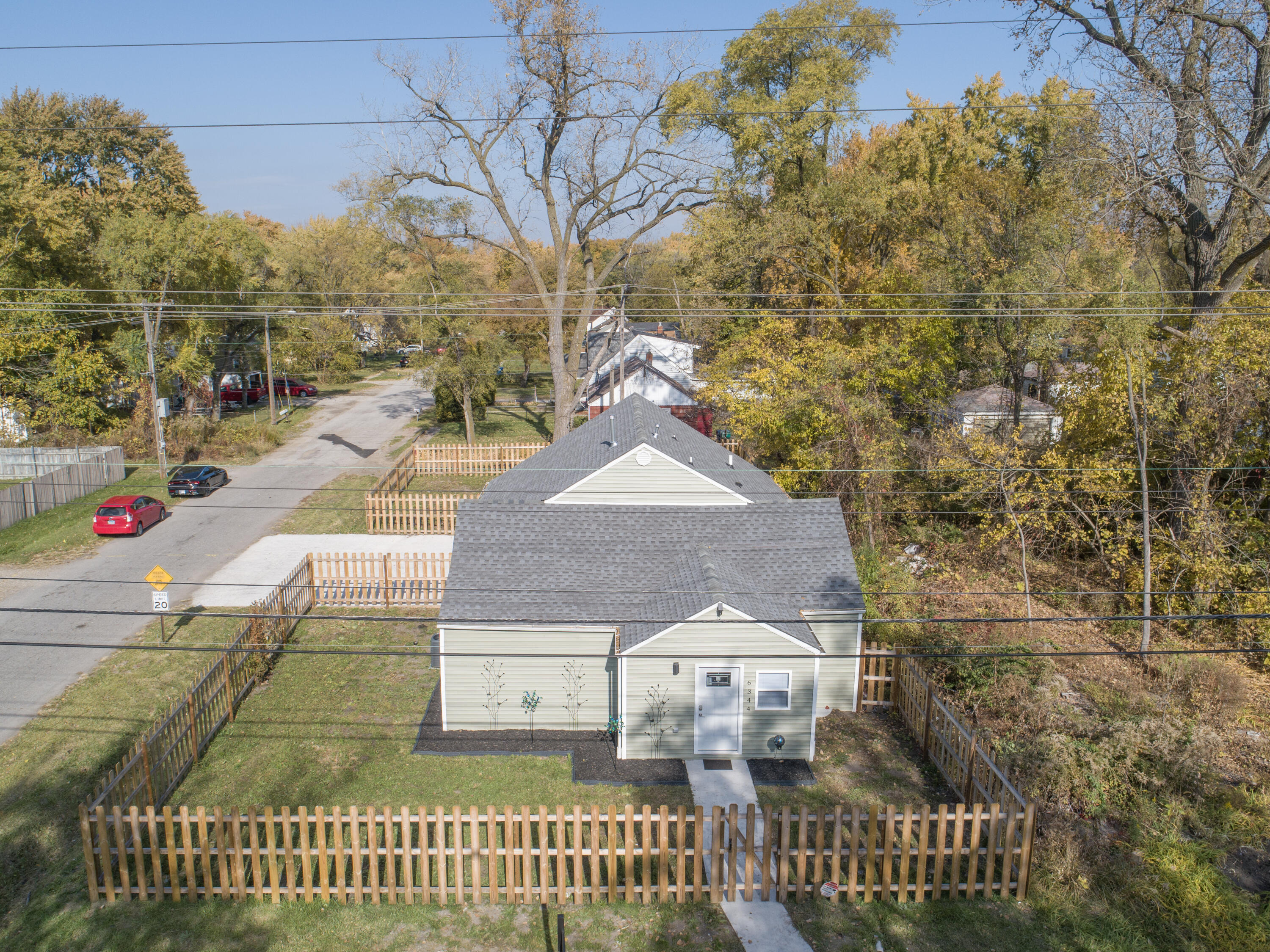 6344 West 25th Avenue Gary, IN 46406 - Photo 46 of 52 a front view of a house with a garden