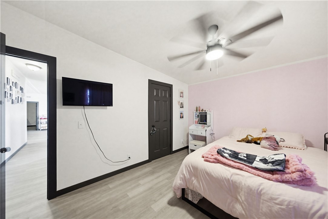 1071 South Estrella Road Golden Valley, AZ 86413 - Photo 23 of 50 a bedroom with a bed and a flat tv screen on dresser