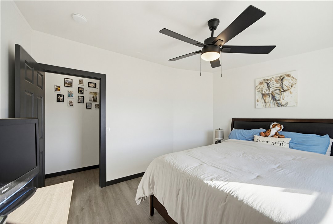 1071 South Estrella Road Golden Valley, AZ 86413 - Photo 26 of 50 a bedroom with a bed and a refrigerator