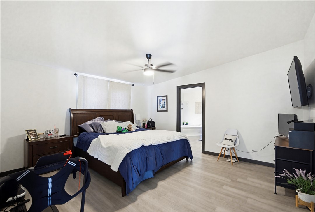 1071 South Estrella Road Golden Valley, AZ 86413 - Photo 27 of 50 a bedroom with a bed and a flat screen tv