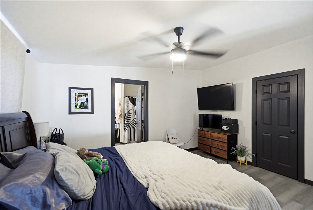 1071 South Estrella Road Golden Valley, AZ 86413 - Photo 28 of 50 a bedroom with a bed and a flat screen tv