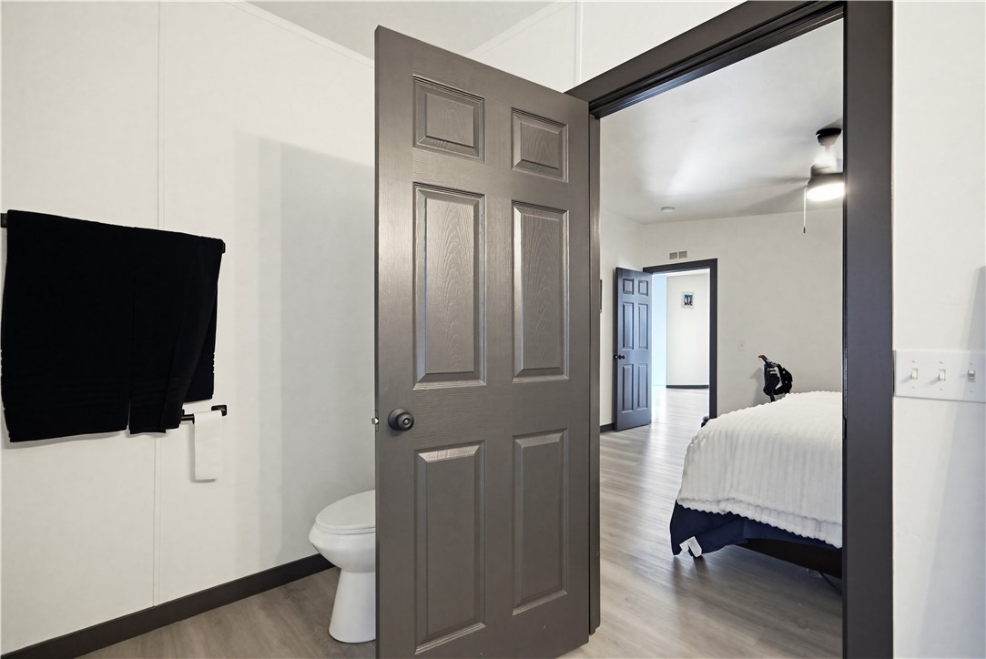 1071 South Estrella Road Golden Valley, AZ 86413 - Photo 32 of 50 a bedroom with a bed and a flat screen tv
