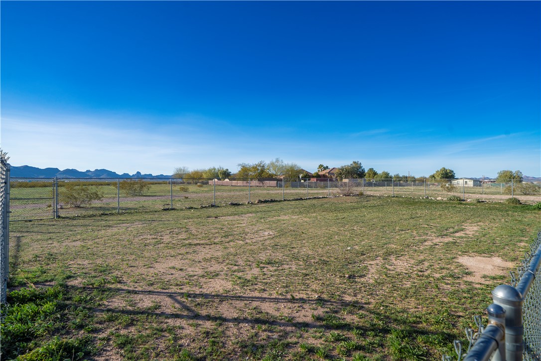 1071 South Estrella Road Golden Valley, AZ 86413 - Photo 39 of 50 a view of a lake with houses