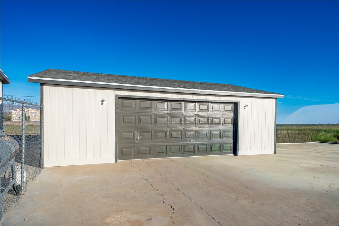 1071 South Estrella Road Golden Valley, AZ 86413 - Photo 41 of 50 a view of outdoor space garage and window