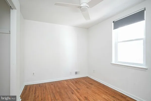 a view of a room that has a window in it