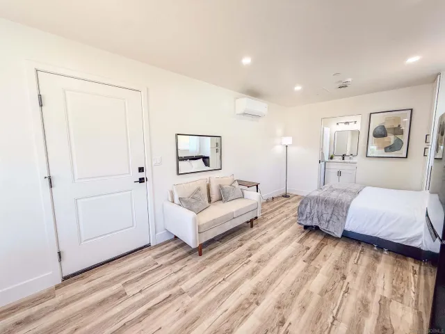 a kitchen with a refrigerator and a sink
