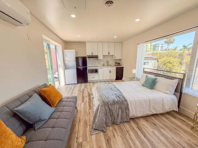 a kitchen with a refrigerator a stove top oven and a refrigerator