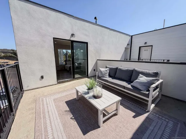 a view of a balcony with car parked