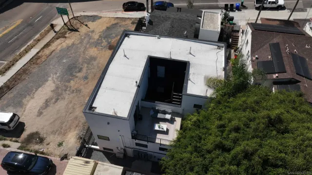 an aerial view of residential houses with outdoor space