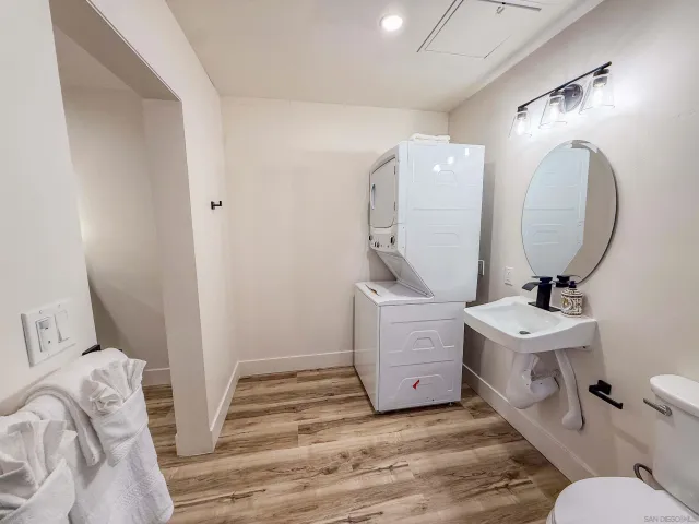 a view of a workspace with furniture and wooden floor