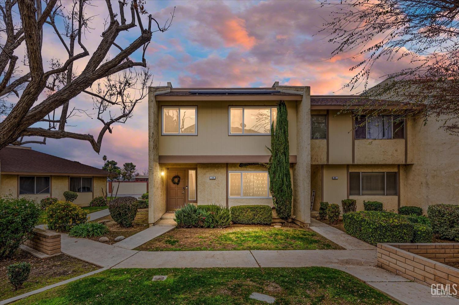 Undisclosed Address Bakersfield, CA 93308 - Photo 1 of 40 a front view of a house with garden