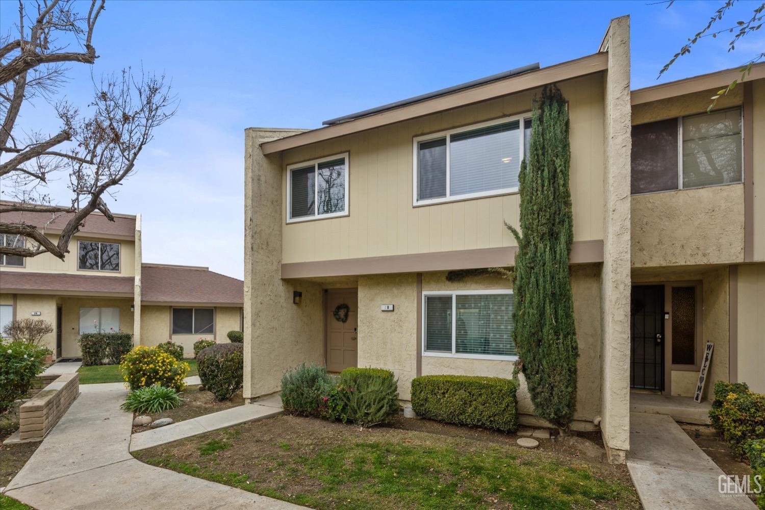 Undisclosed Address Bakersfield, CA 93308 - Photo 2 of 40 a front view of a house with garden