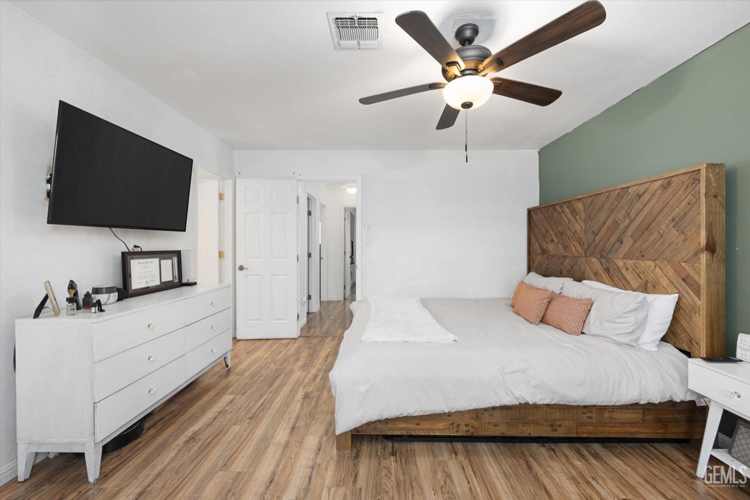Undisclosed Address Bakersfield, CA 93308 - Photo 30 of 40 a bedroom with a bed and a flat screen tv