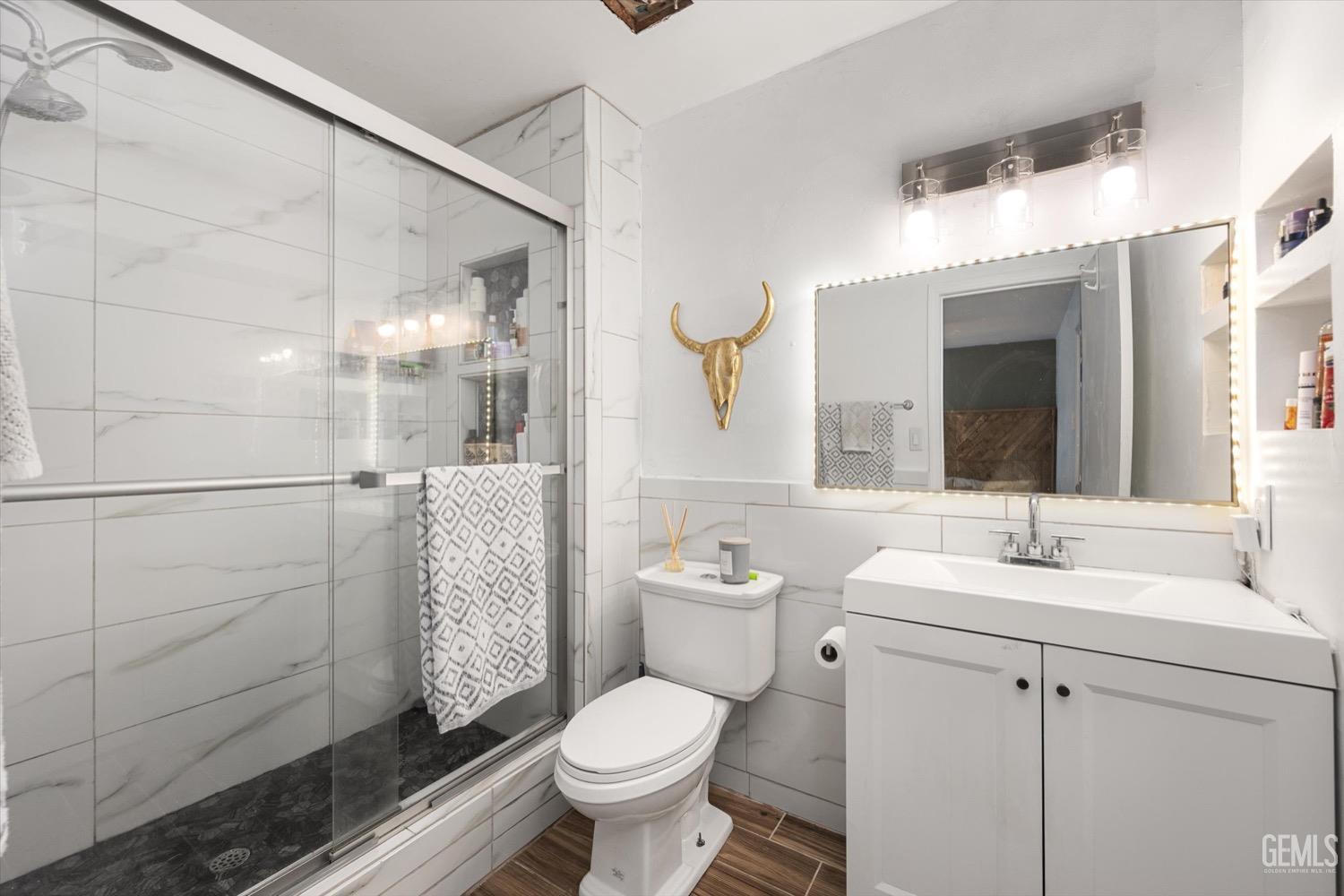 Undisclosed Address Bakersfield, CA 93308 - Photo 32 of 40 a bathroom with a sink toilet and shower