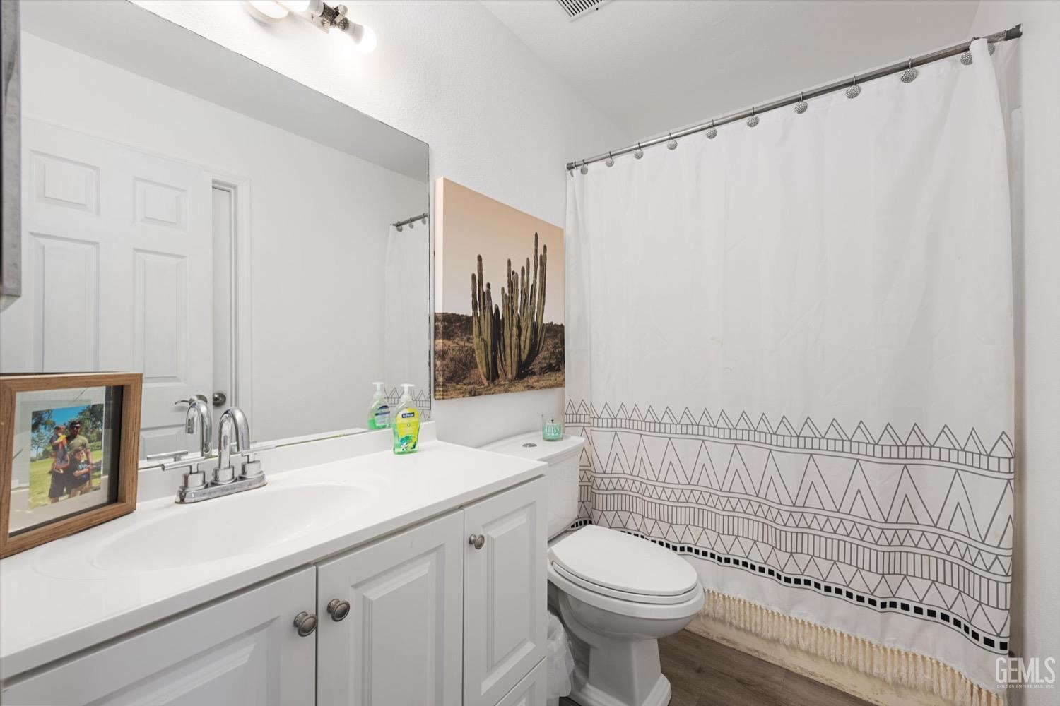 Undisclosed Address Bakersfield, CA 93308 - Photo 33 of 40 a bathroom with a sink a toilet and shower