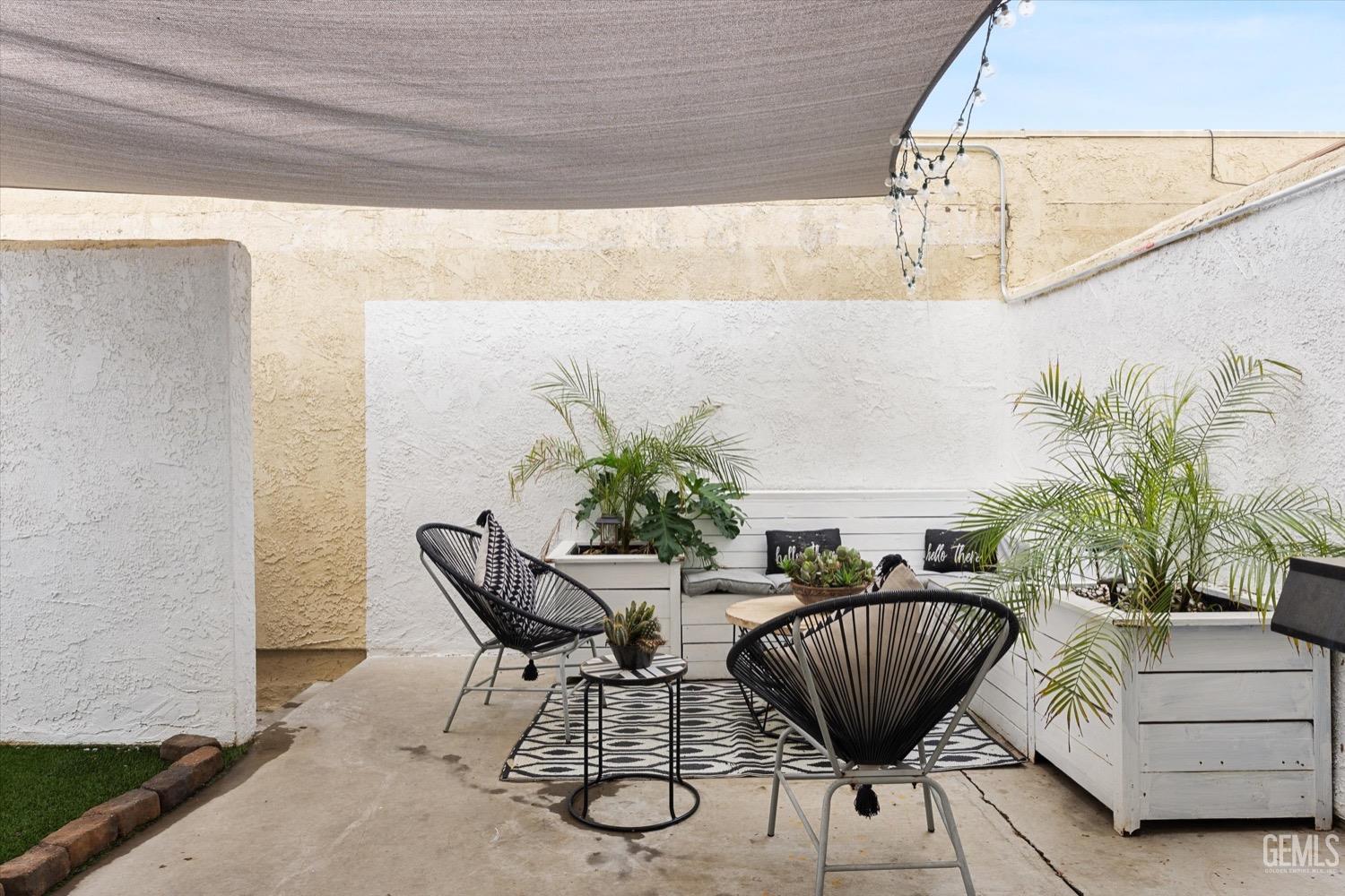 Undisclosed Address Bakersfield, CA 93308 - Photo 37 of 40 a table and chairs in a patio