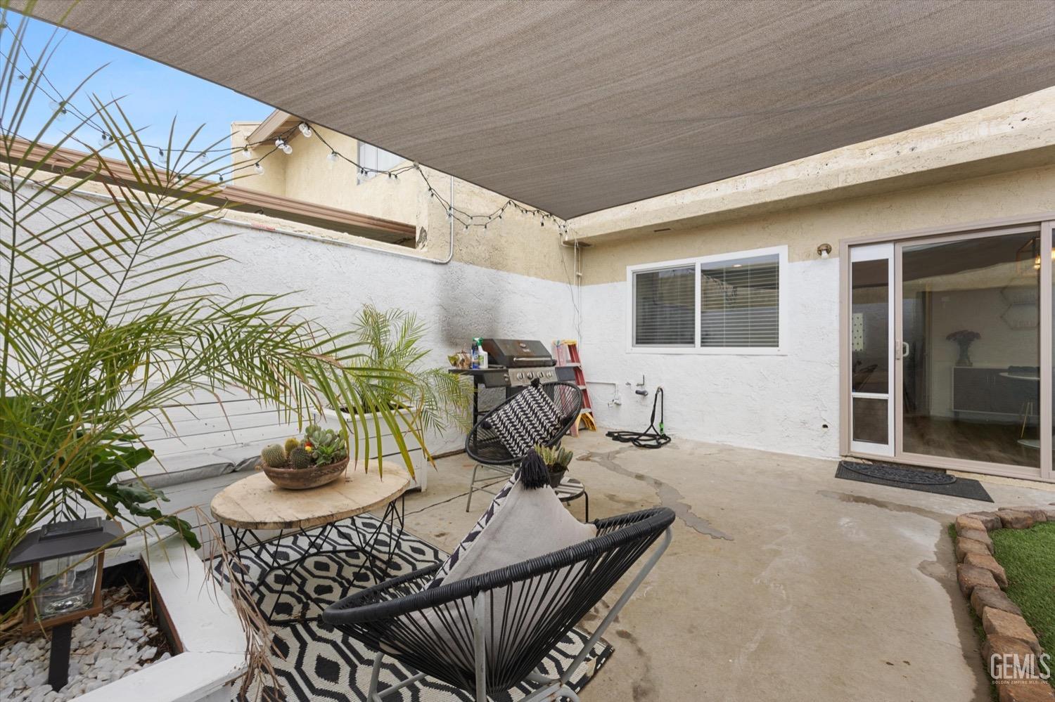 Undisclosed Address Bakersfield, CA 93308 - Photo 39 of 40 a view of a balcony dining table and chairs