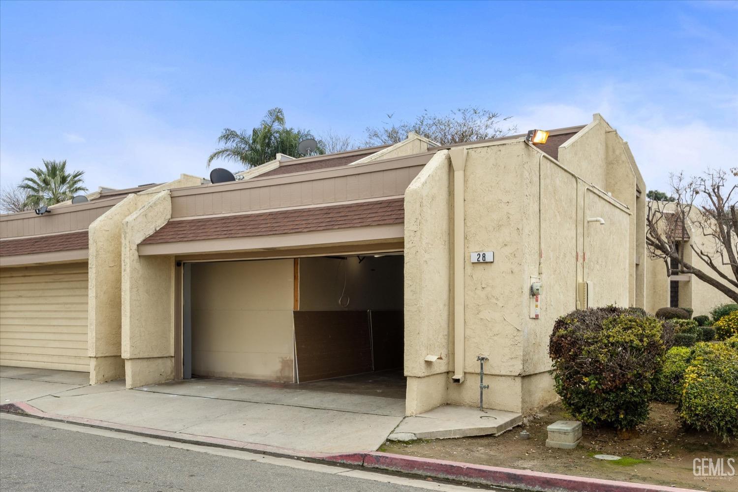 Undisclosed Address Bakersfield, CA 93308 - Photo 40 of 40 a view of a house with potted plants