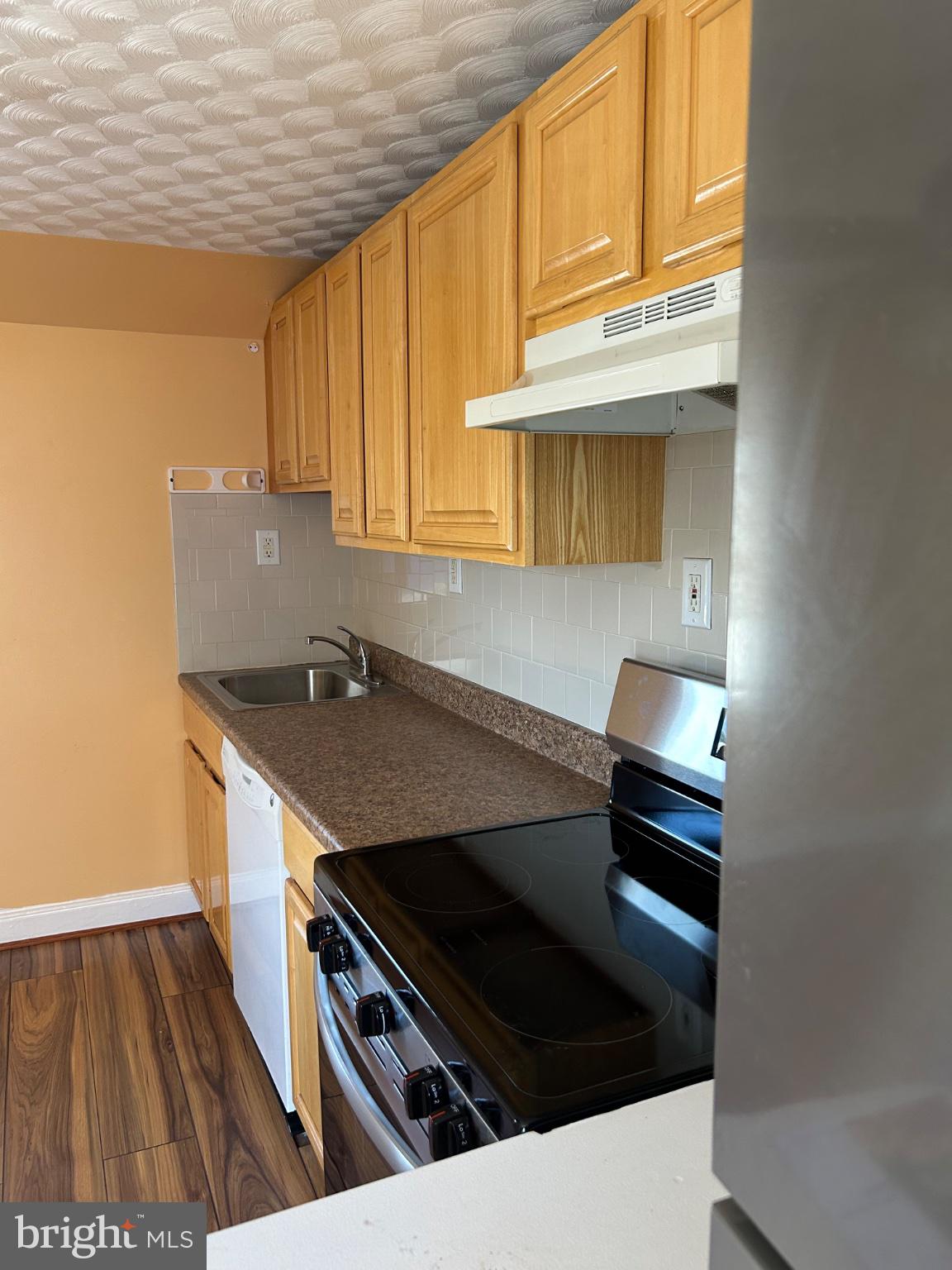 431 Rhawn Street Philadelphia, PA 19111 - Photo 4 of 12 Cozy kitchen with warm wood accents.
