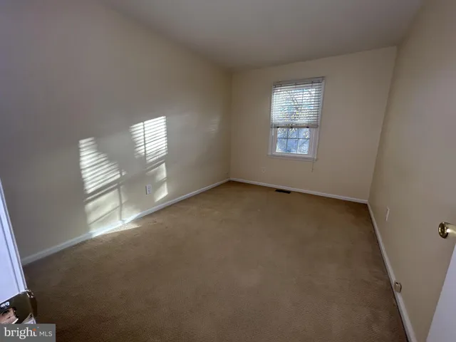 a backyard of a house with wooden fence