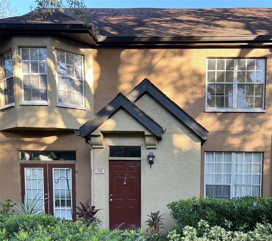 a view of a house with a door and a window