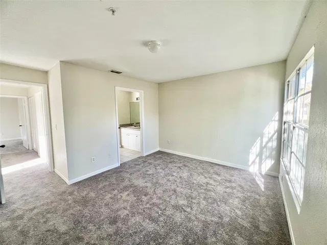 a view of an empty room and window