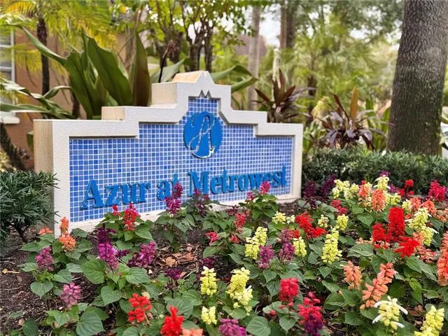 a view of a house with a flower garden