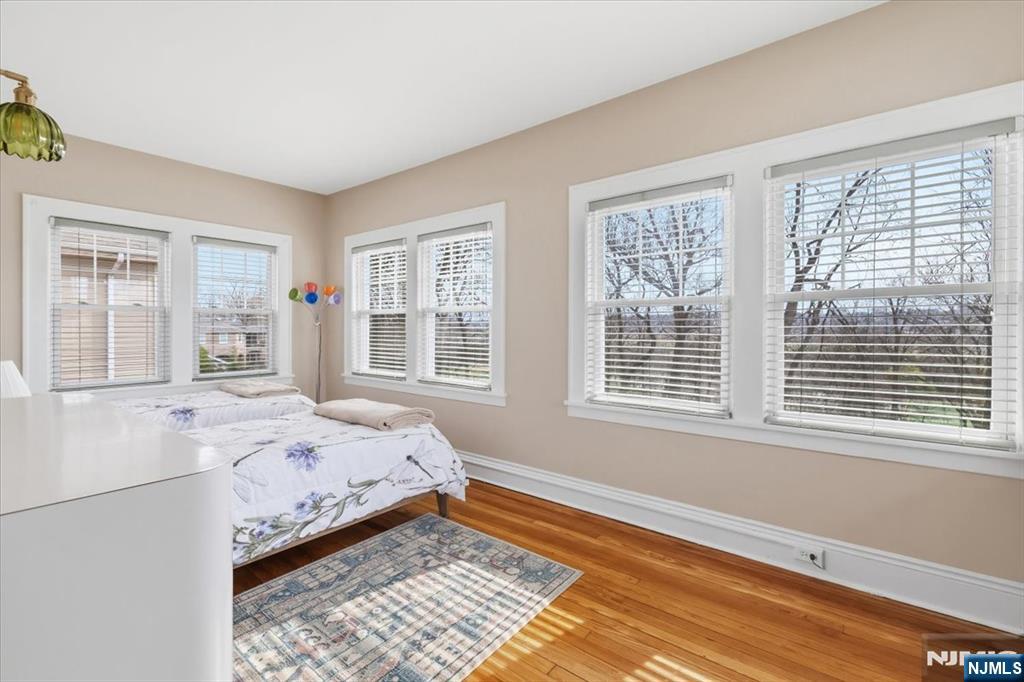 119 Overpeck Avenue Ridgefield Park, NJ 07660 - Photo 17 of 44 a bedroom with a bed and a window
