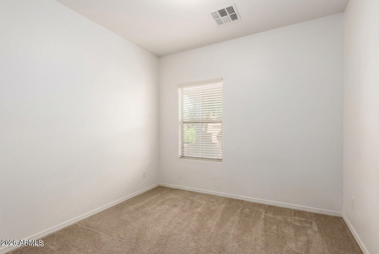 16947 West Cocopah Street Goodyear, AZ 85338 - Photo 12 of 22 an empty room with a window
