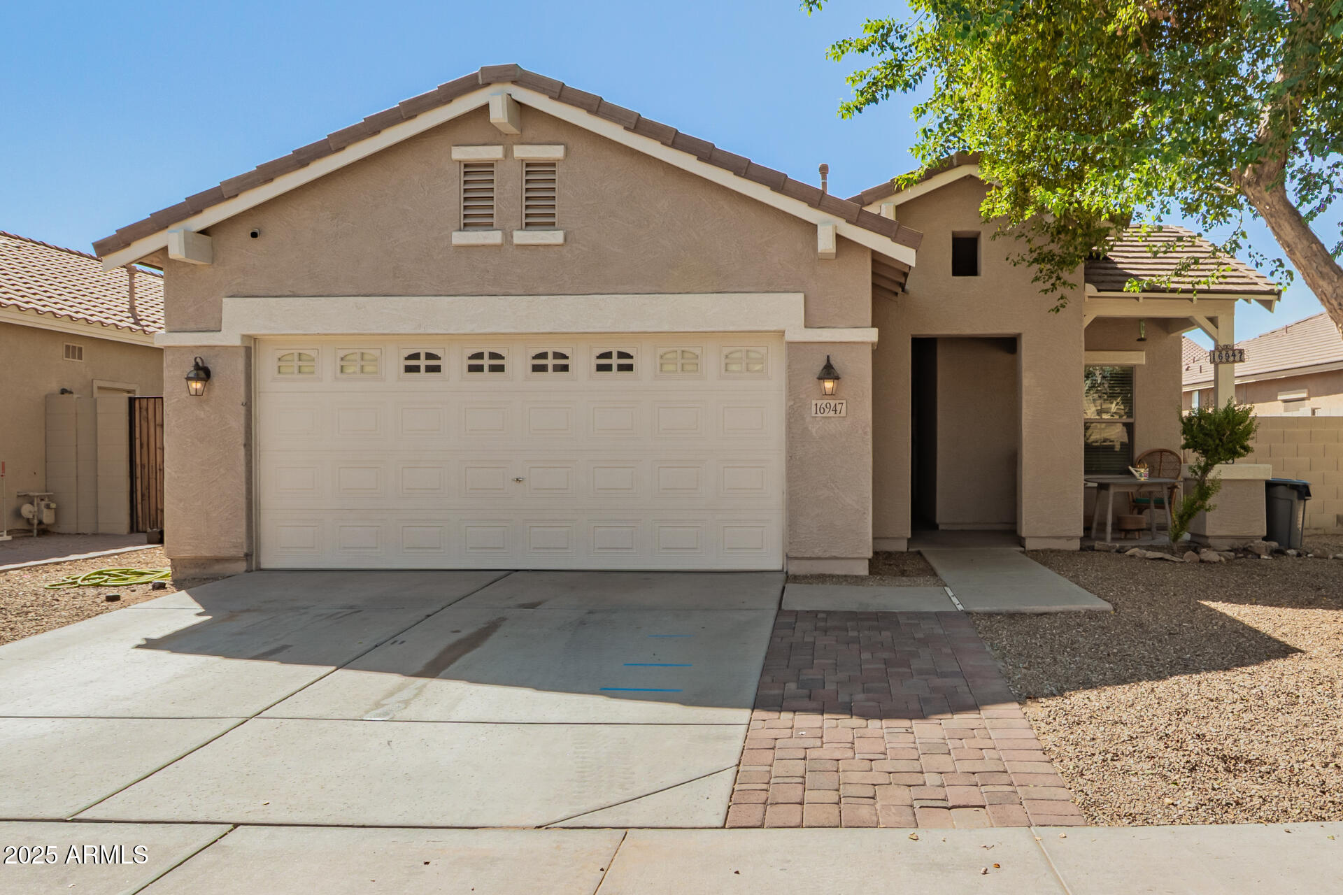 16947 West Cocopah Street Goodyear, AZ 85338 - Photo 18 of 22 a front view of a house with a yard