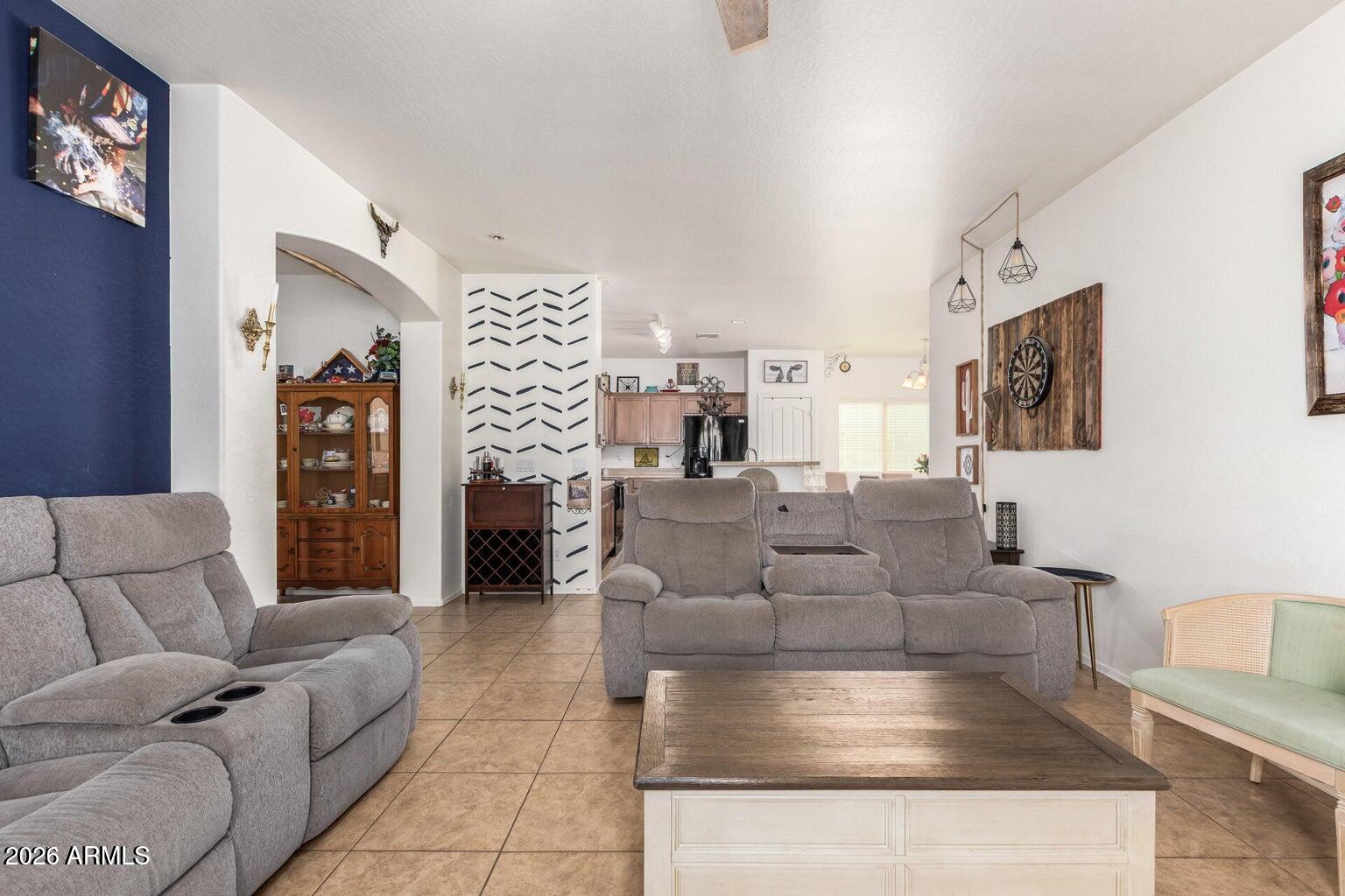 16947 West Cocopah Street Goodyear, AZ 85338 - Photo 22 of 22 a living room with furniture and a couch