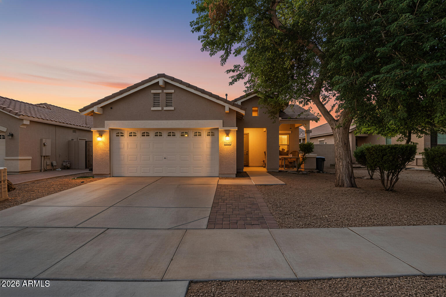 16947 West Cocopah Street Goodyear, AZ 85338 - Photo 3 of 22 a front view of a house with a yard and garage