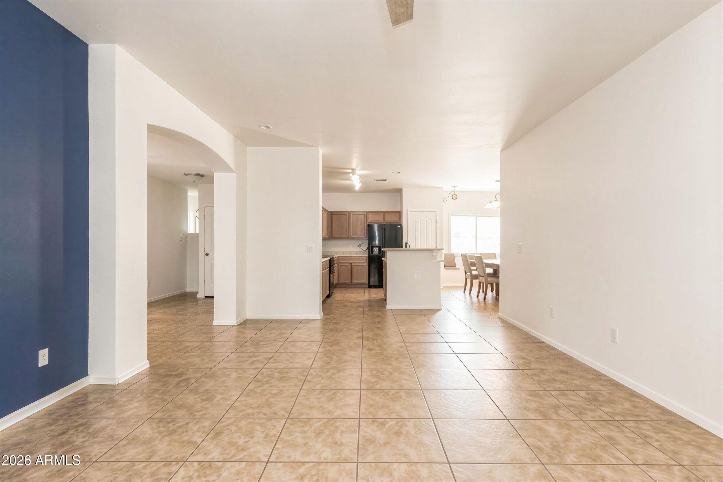 16947 West Cocopah Street Goodyear, AZ 85338 - Photo 5 of 22 a view of a kitchen with furniture and an empty room