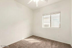 16947 West Cocopah Street Goodyear, AZ 85338 - Photo 8 of 22 an empty room with a window