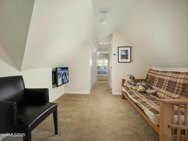 a bedroom with bed and a couch