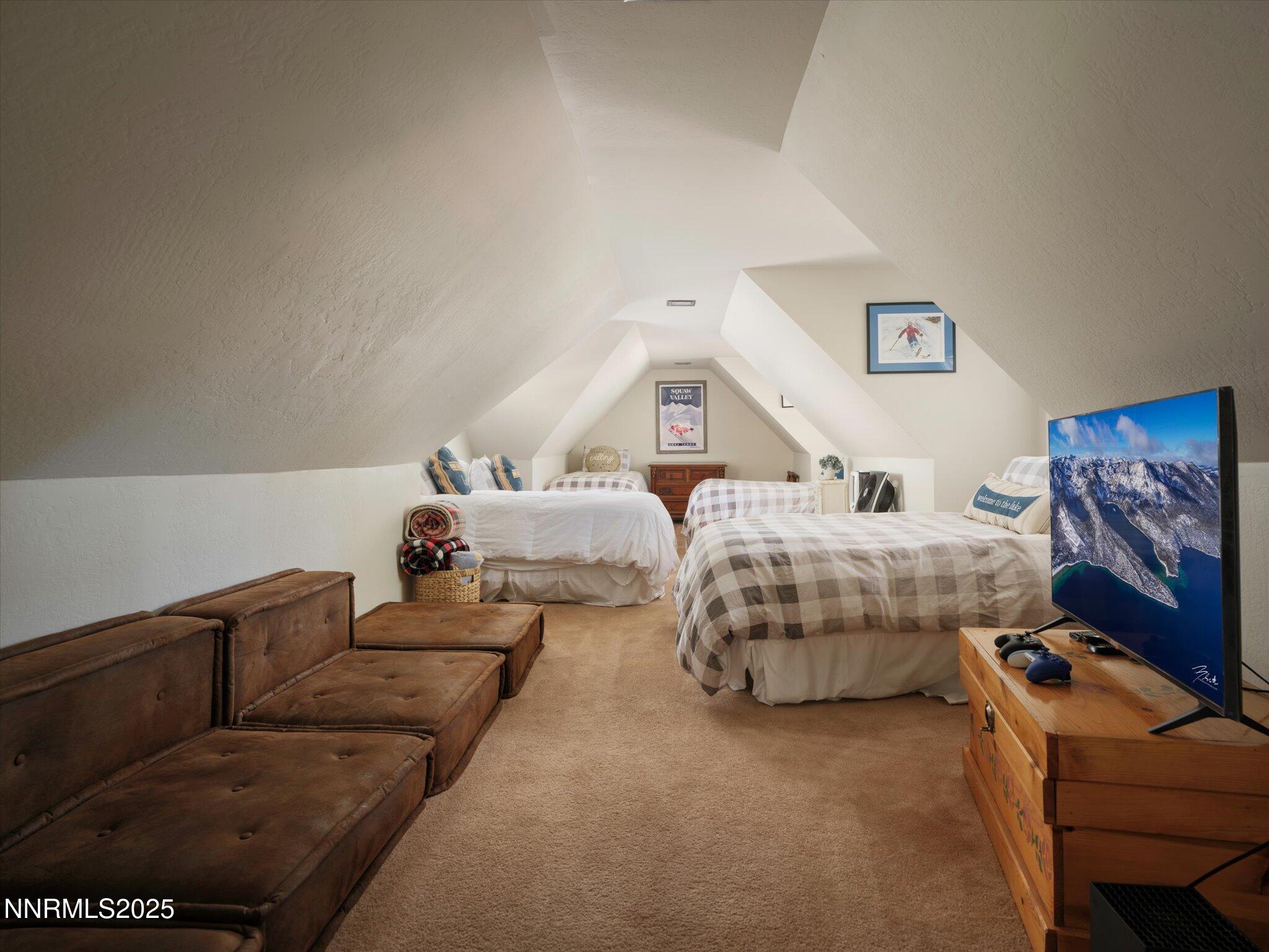 644 Job Lane Zephyr Cove, NV 89448 - Photo 15 of 26 a bedroom with bed and a couch