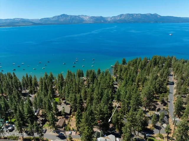 a view of a patio with table and chairs under an umbrella