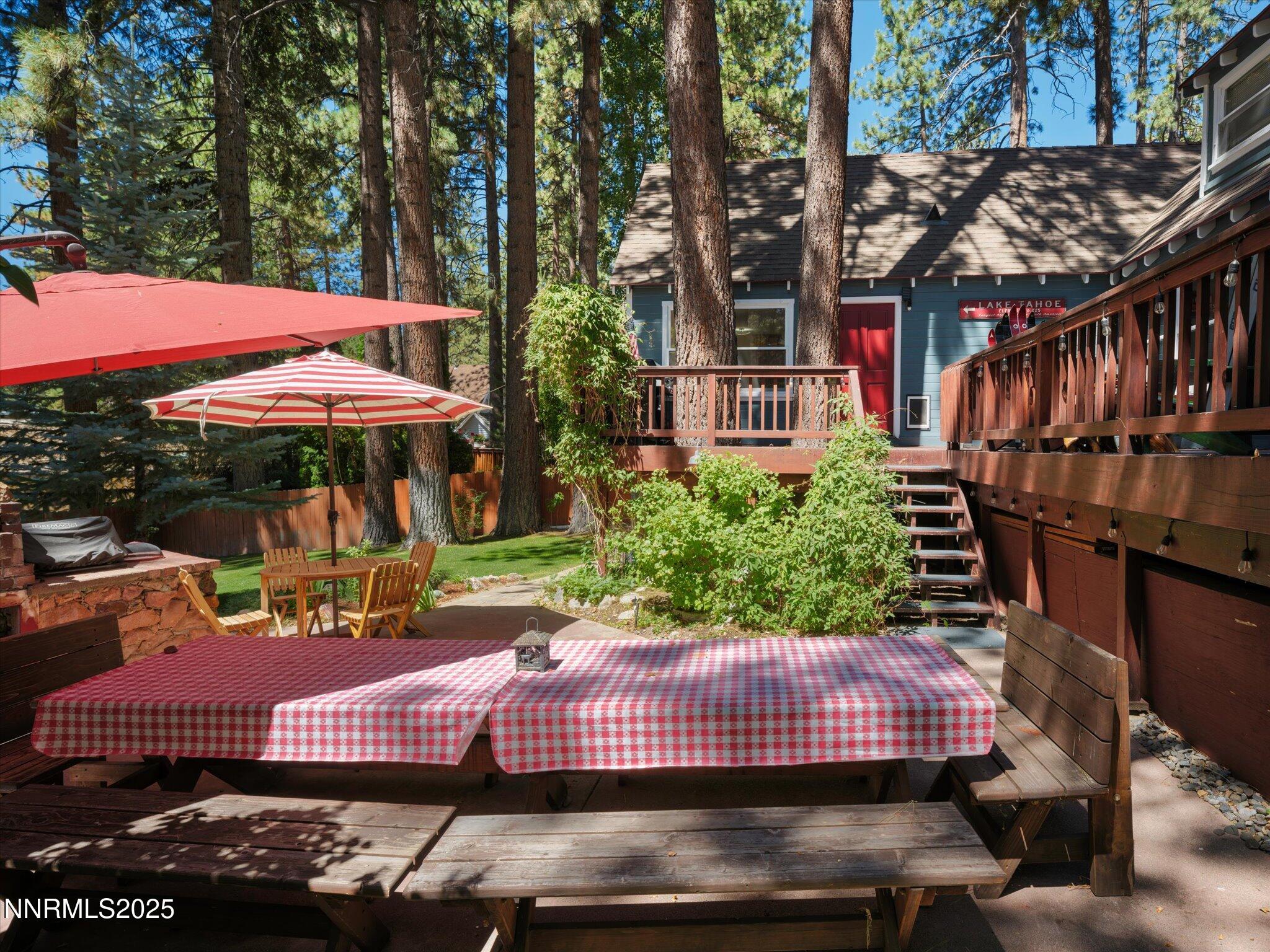644 Job Lane Zephyr Cove, NV 89448 - Photo 20 of 26 a view of a patio with a table chairs and a fire pit