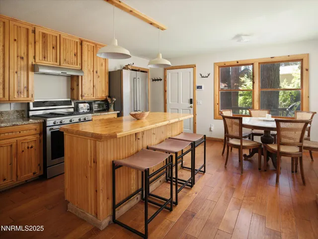 a bathroom with a sink and mirror with toilet