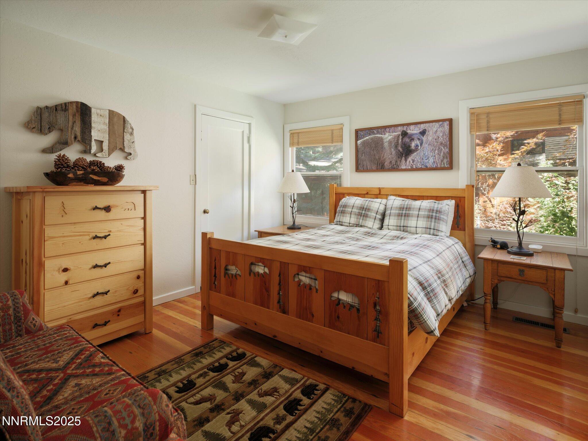 644 Job Lane Zephyr Cove, NV 89448 - Photo 9 of 26 a bedroom with a bed and wooden floor